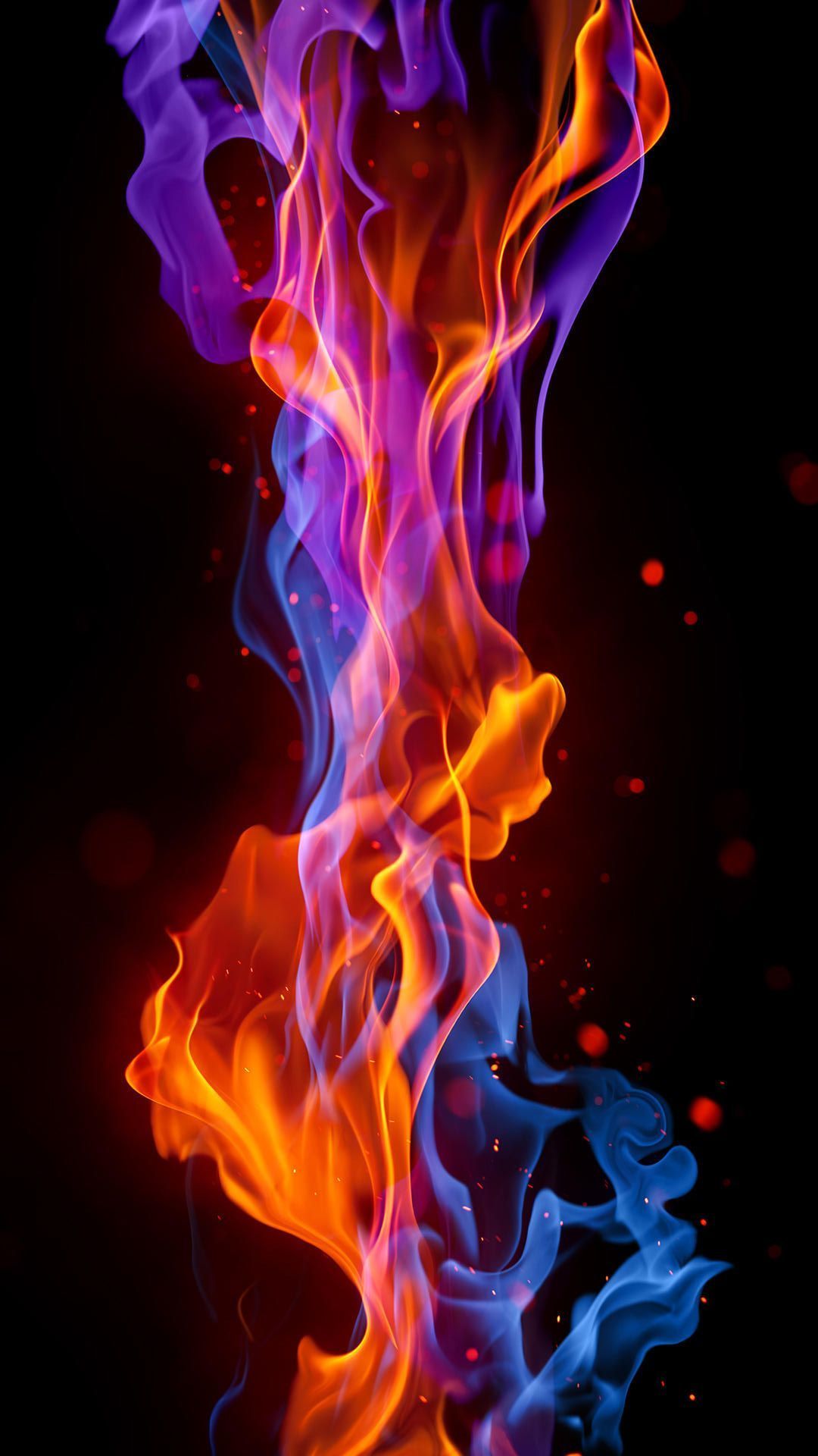 A colorful flame is shown on black background - Fire, flames