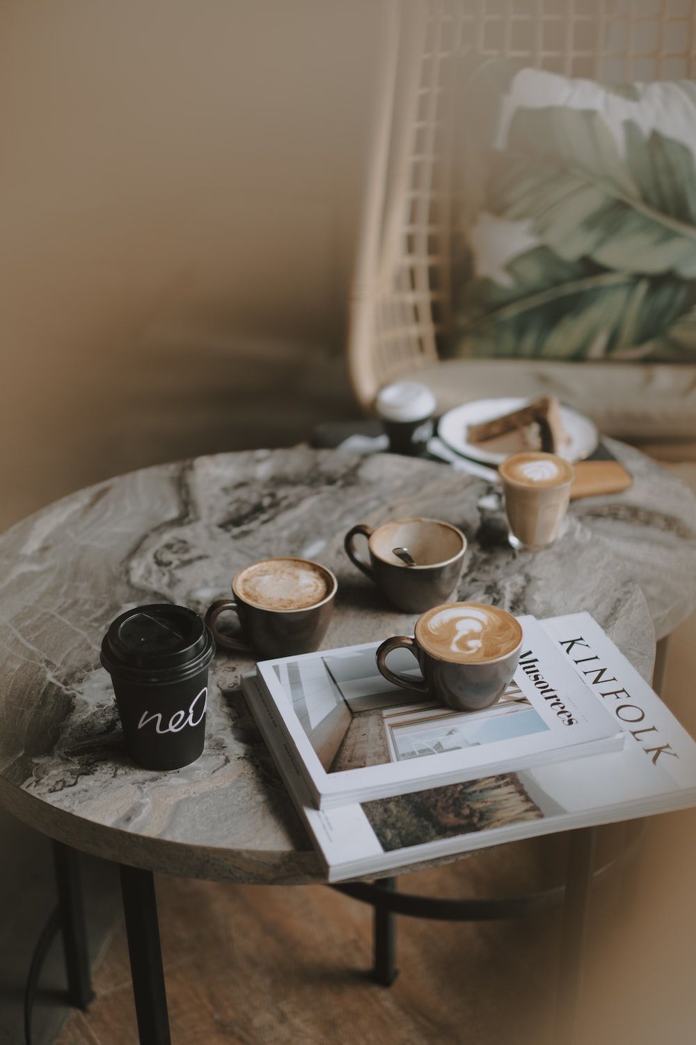 Coffee cups and books on a table - Coffee