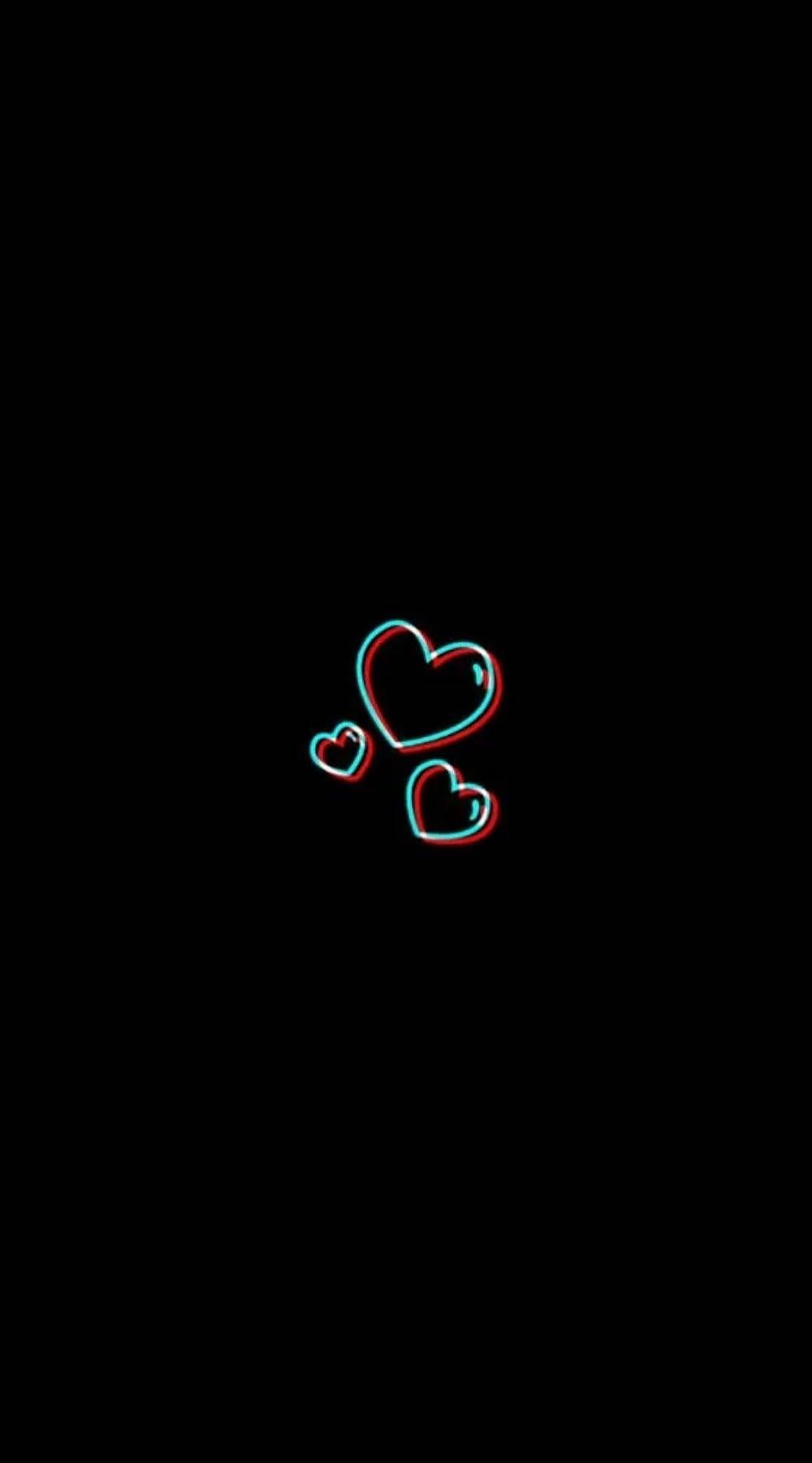 A heart shaped object is on the black background - Black heart