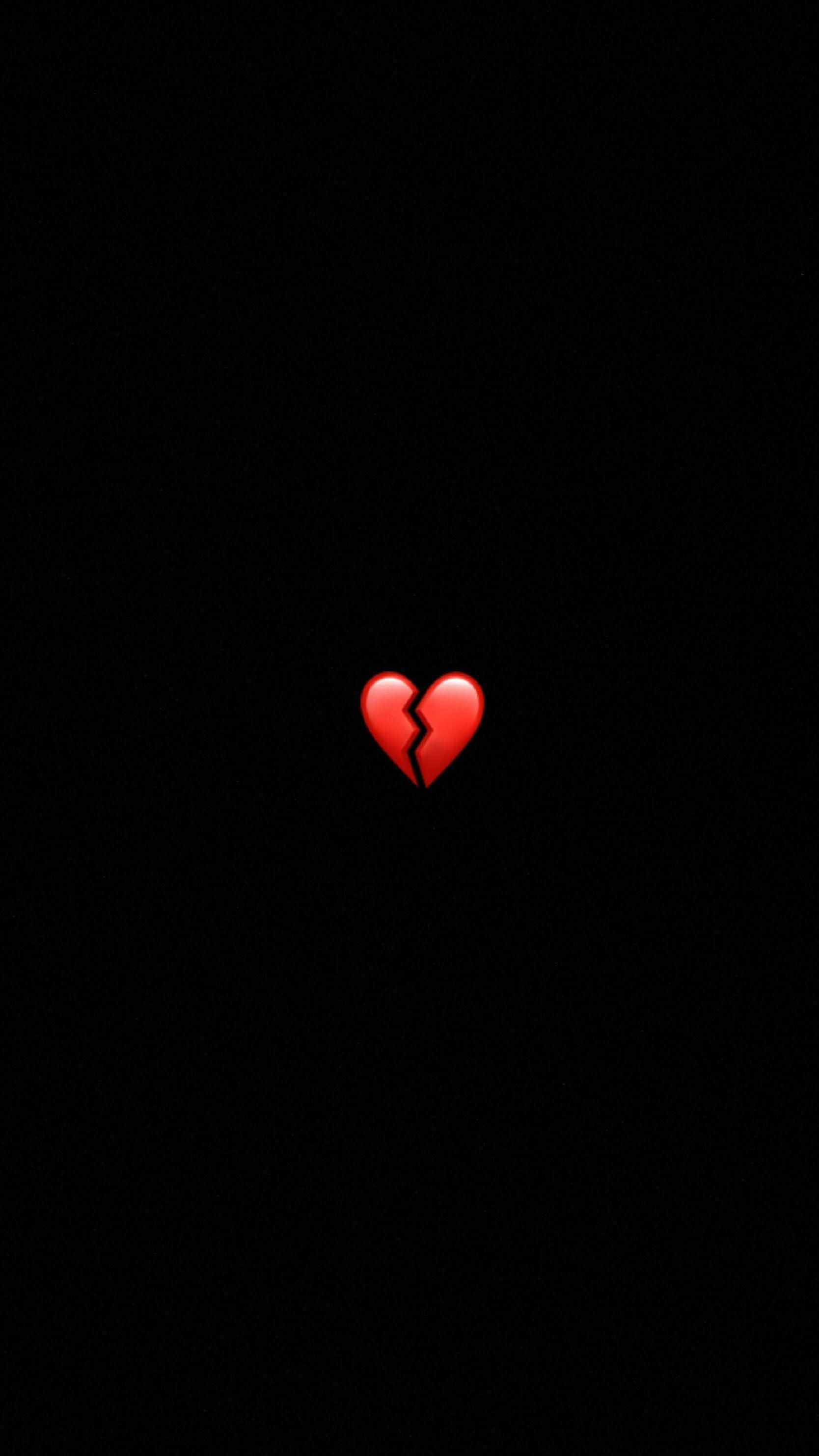 A broken heart is shown in the dark - Black heart