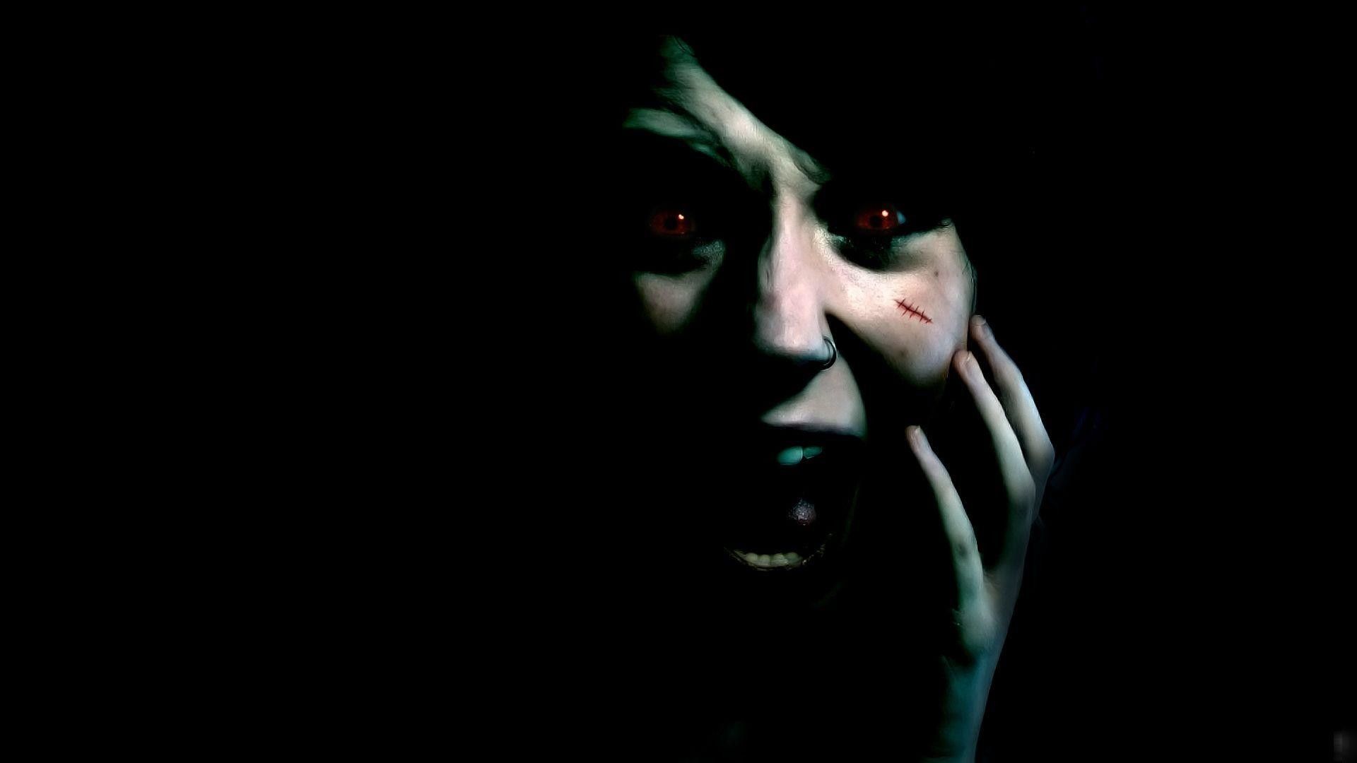 A woman with red eyes in the dark - Horror, creepy