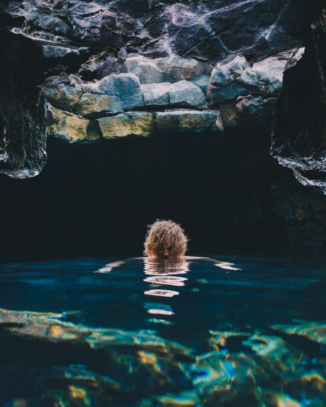 A person swimming in a cave - Horror