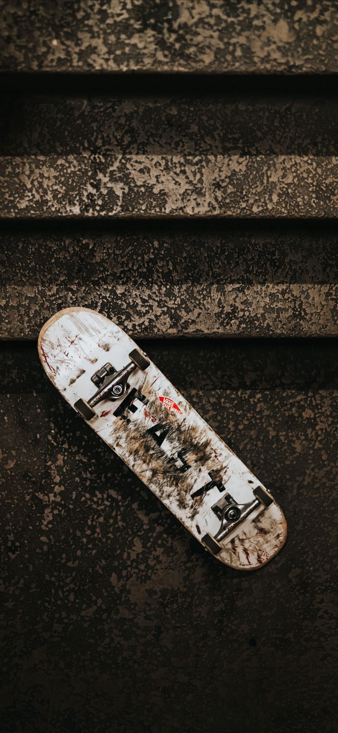IPhone wallpaper of a dirty skateboard on a black surface - Skate, skater