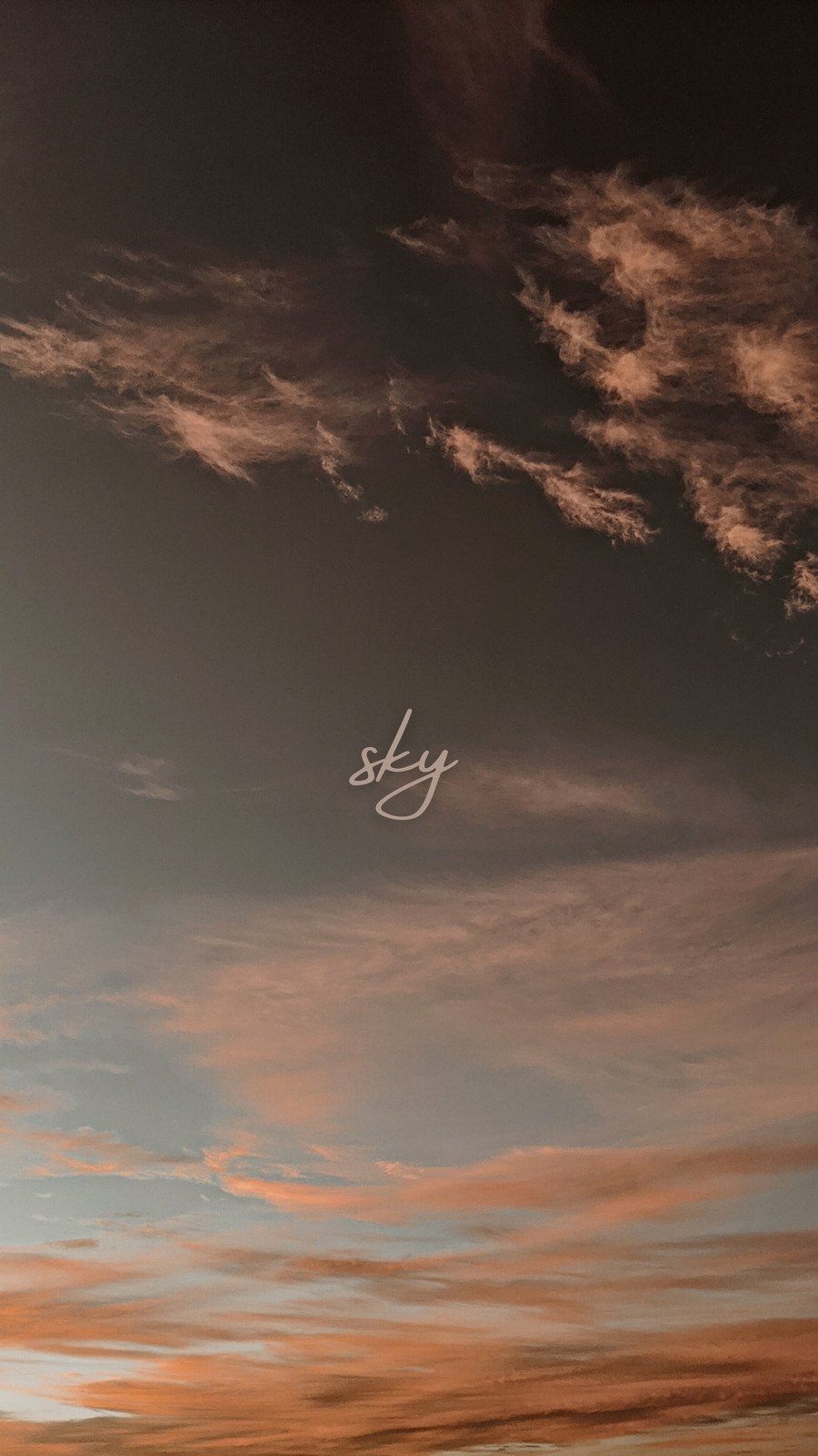 A plane flying over the clouds at sunset - Sky
