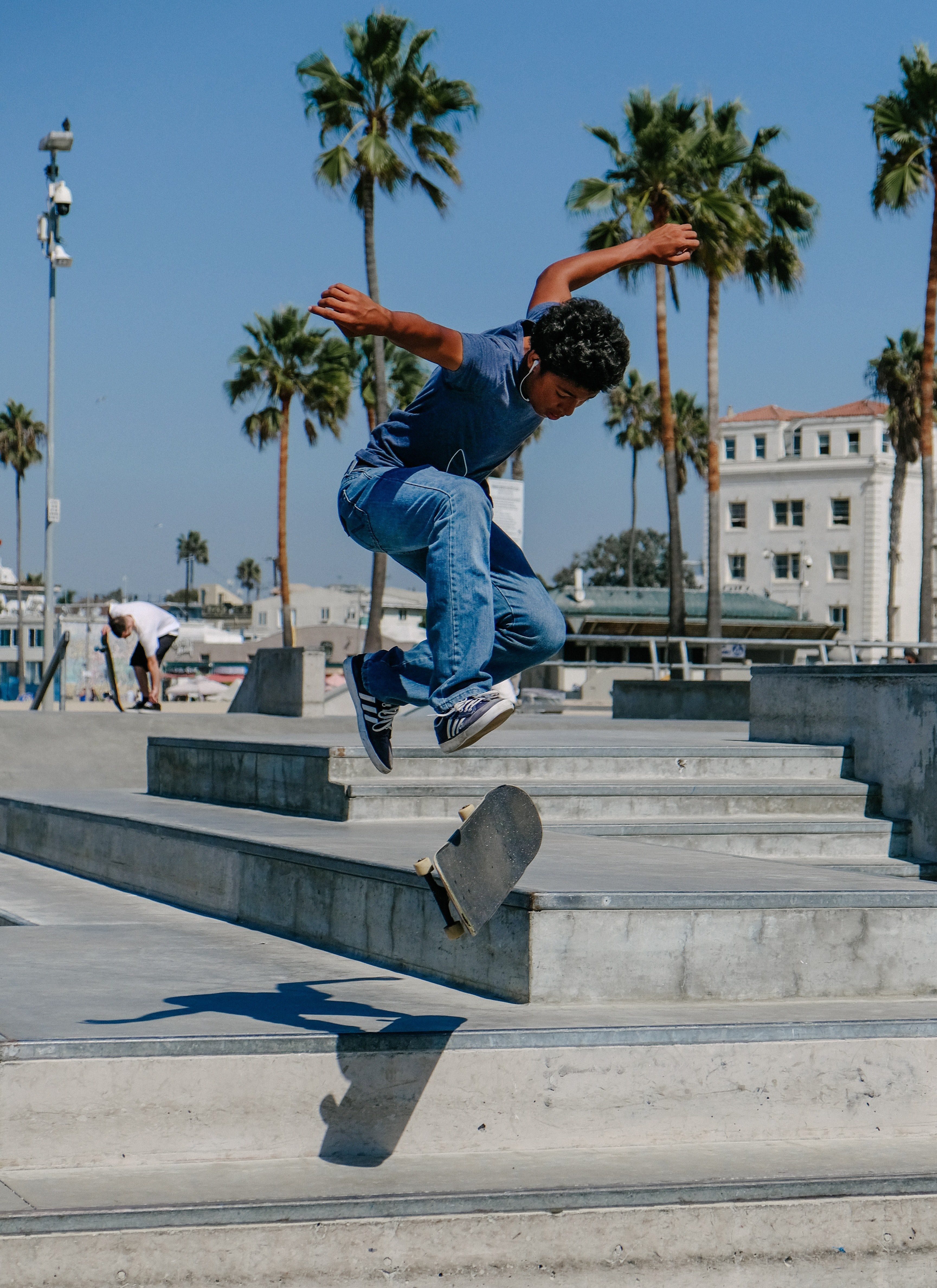 Wallpaper / skateboard skate park kick flip and palm tree HD 4k wallpaper free download