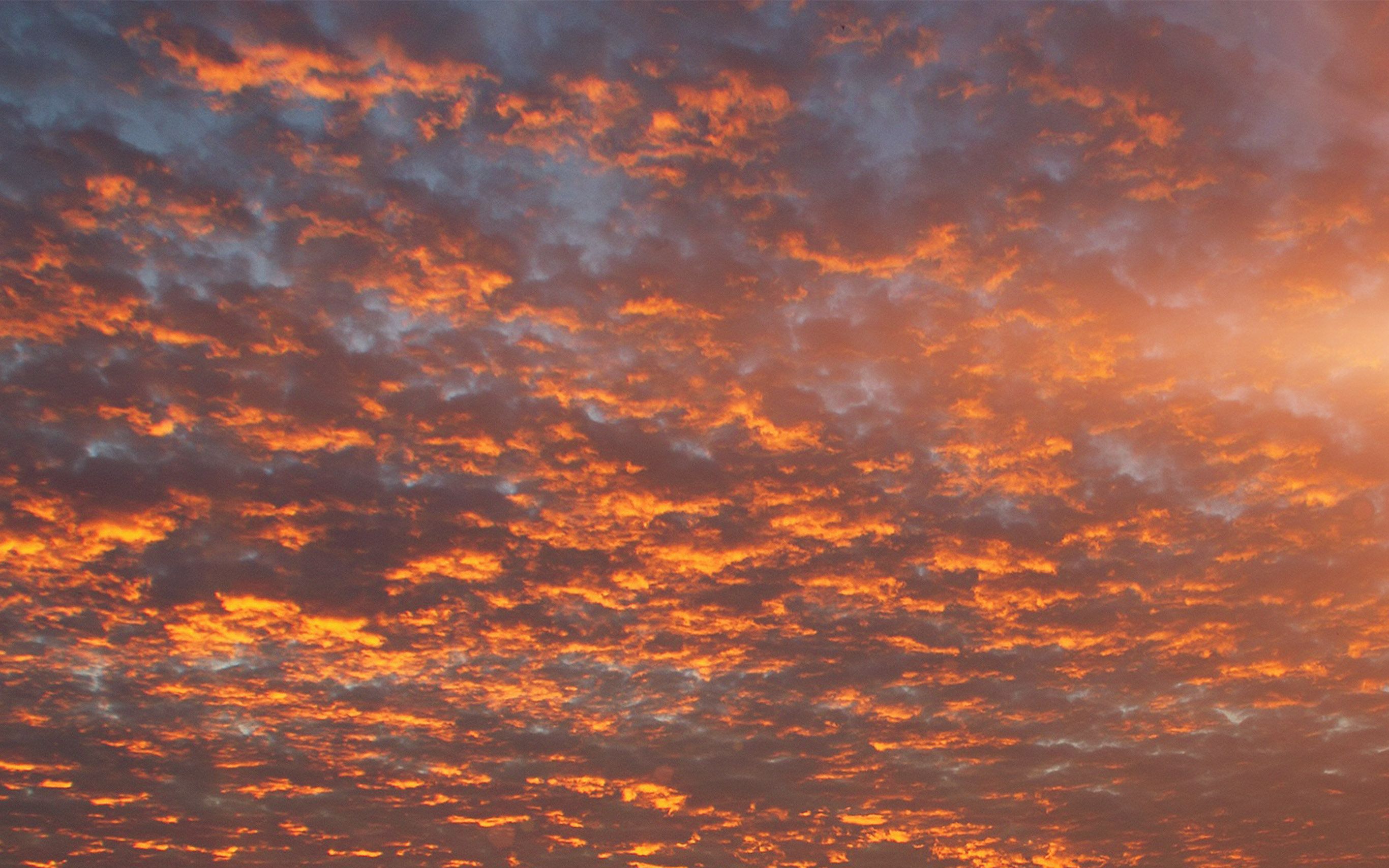 A photo of a sunset with clouds in the sky. - Desktop, vintage clouds, warm, sunrise
