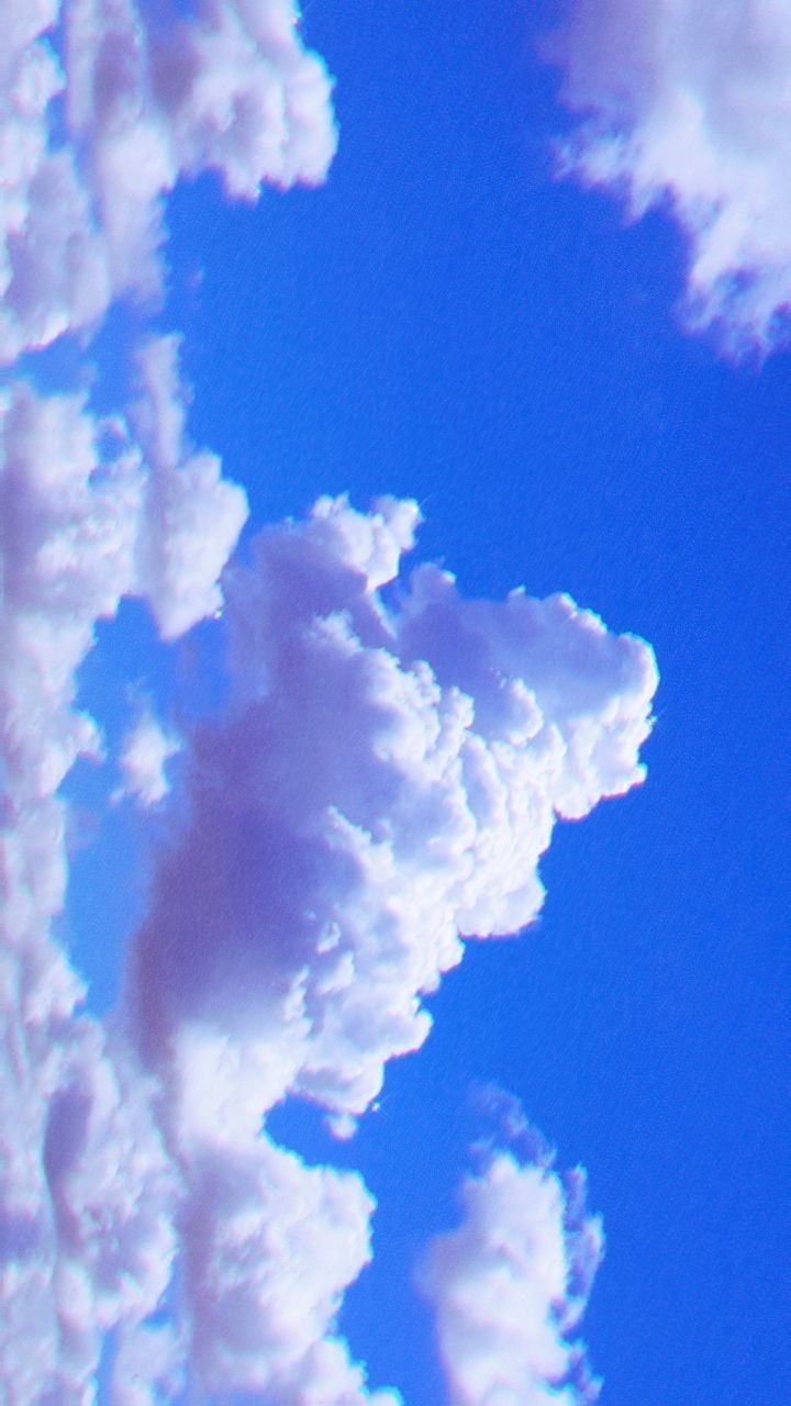 A plane flying through the clouds in blue sky - Vintage clouds, cloud