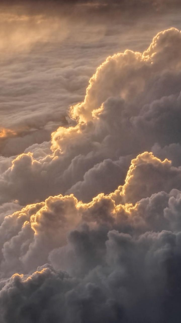 A sky view of clouds with a yellow tint. - Vintage clouds, sunlight