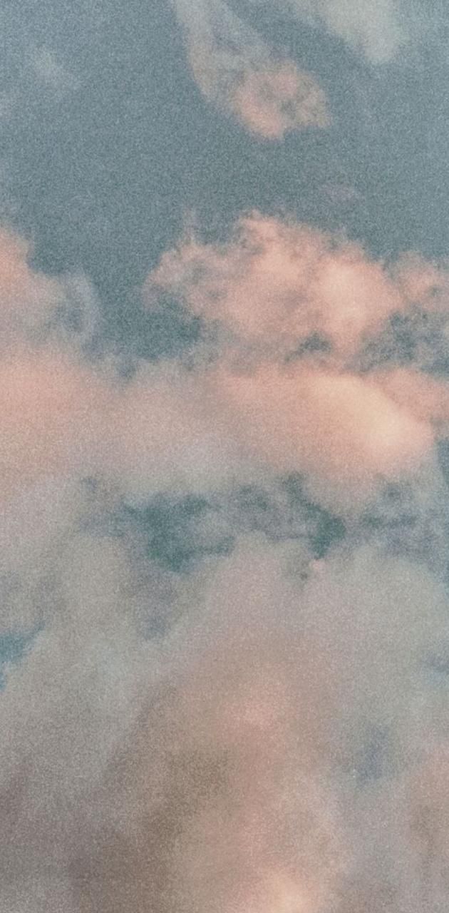 A pink and white cloudy sky with some birds flying - Vintage clouds