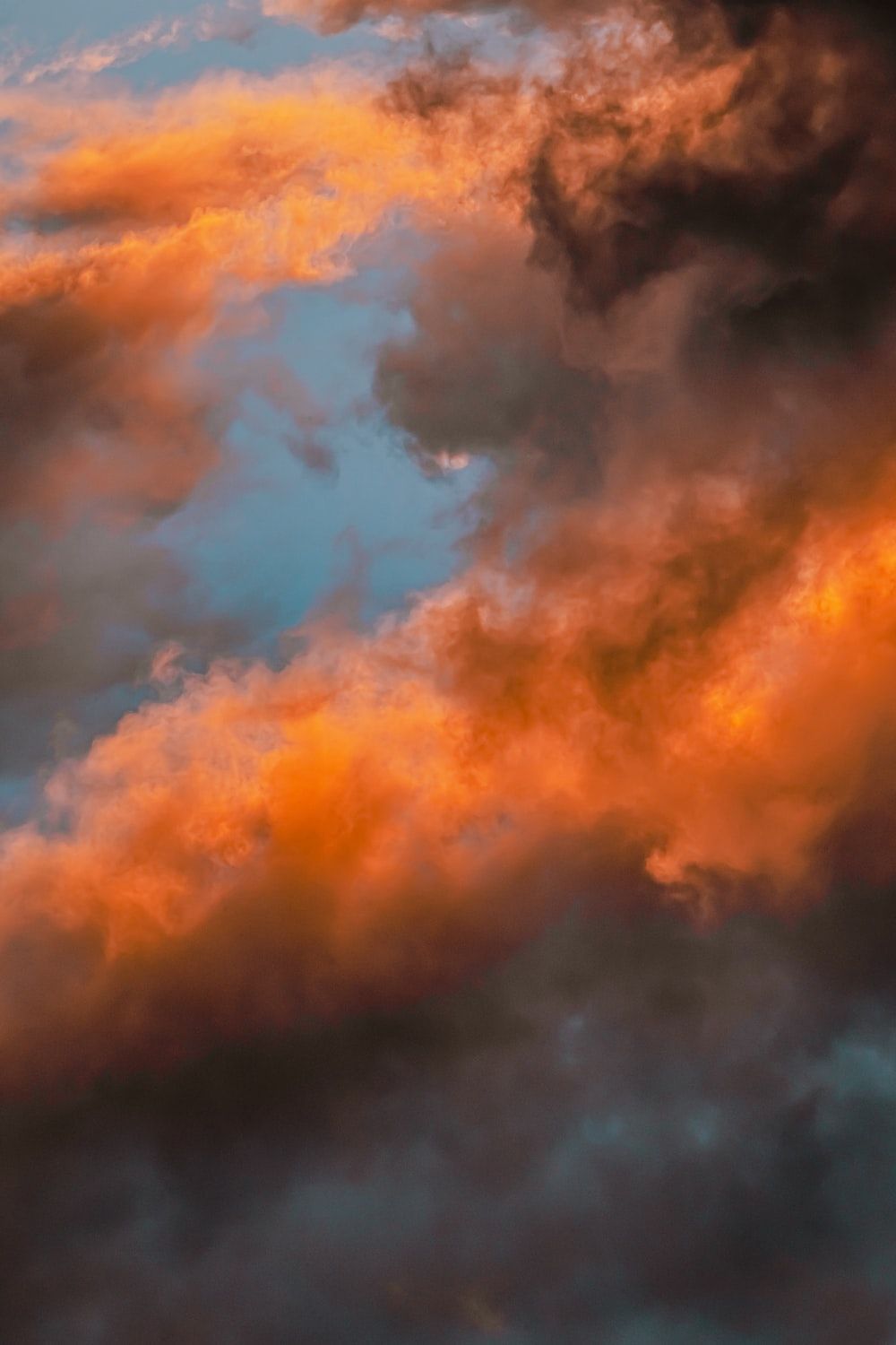 orange and black clouds during daytime photo