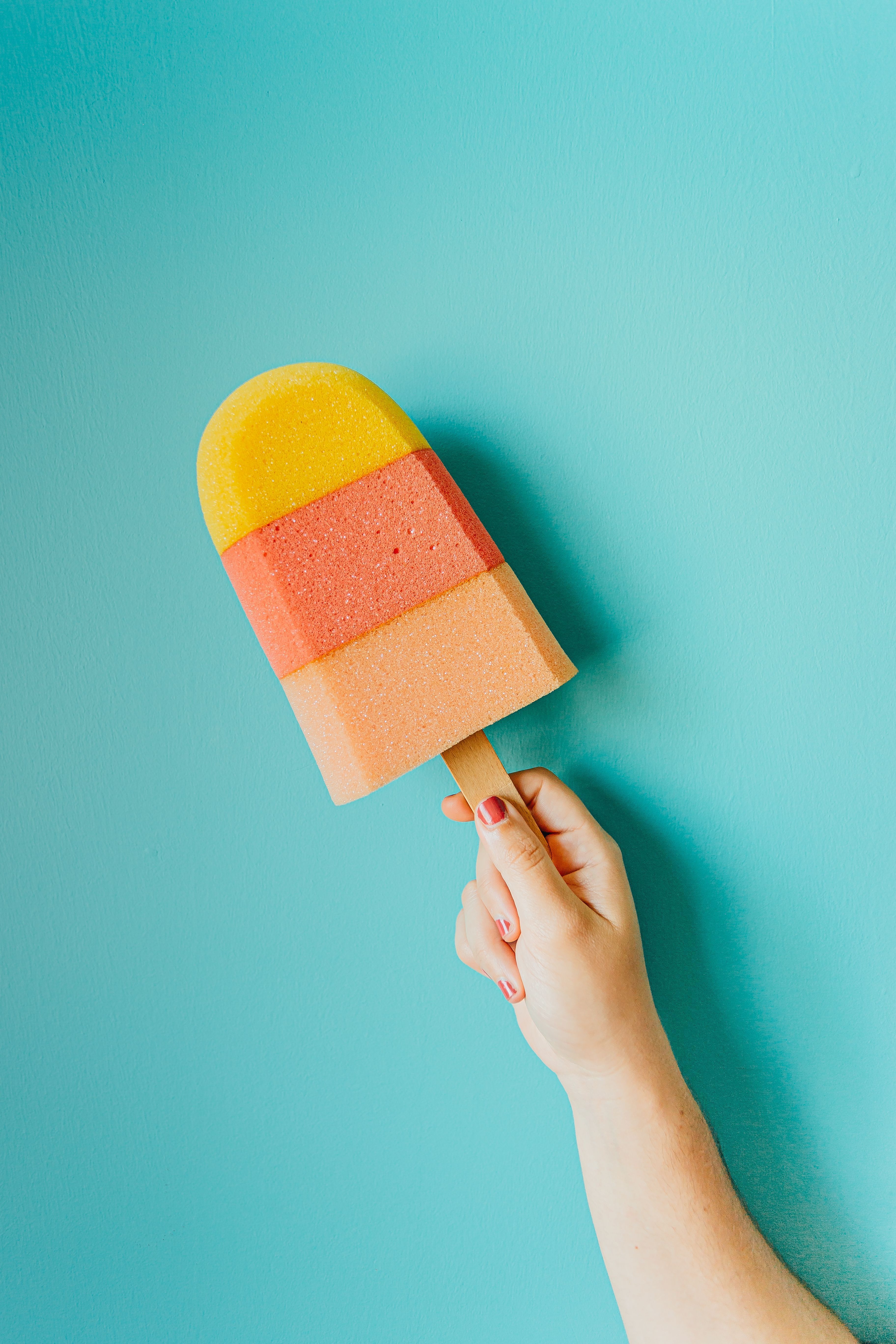 A person holding an ice cream cone - Cream, ice cream