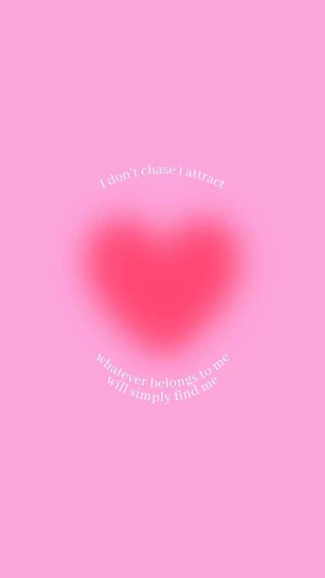 A heart shaped pink background with the words, ``the world is yours'' - Preppy