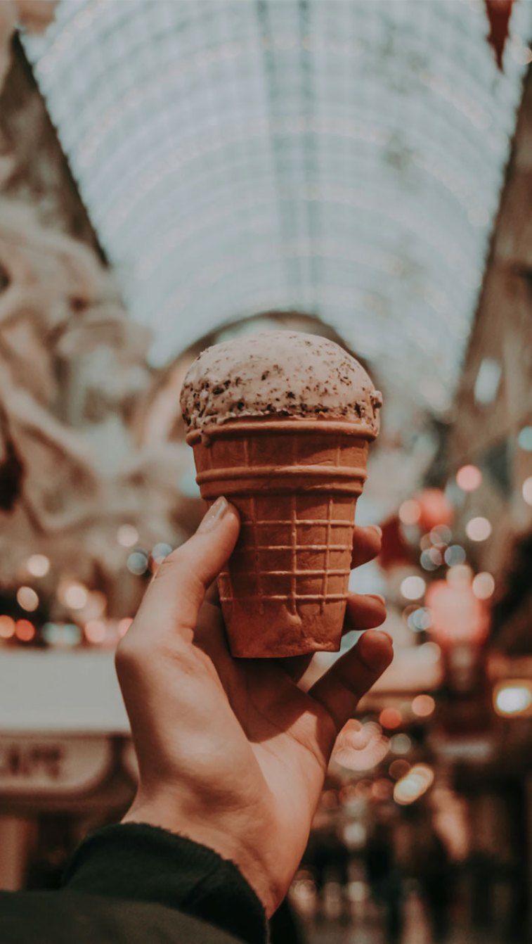 A person holding an ice cream cone in their hand - Ice cream, coffee