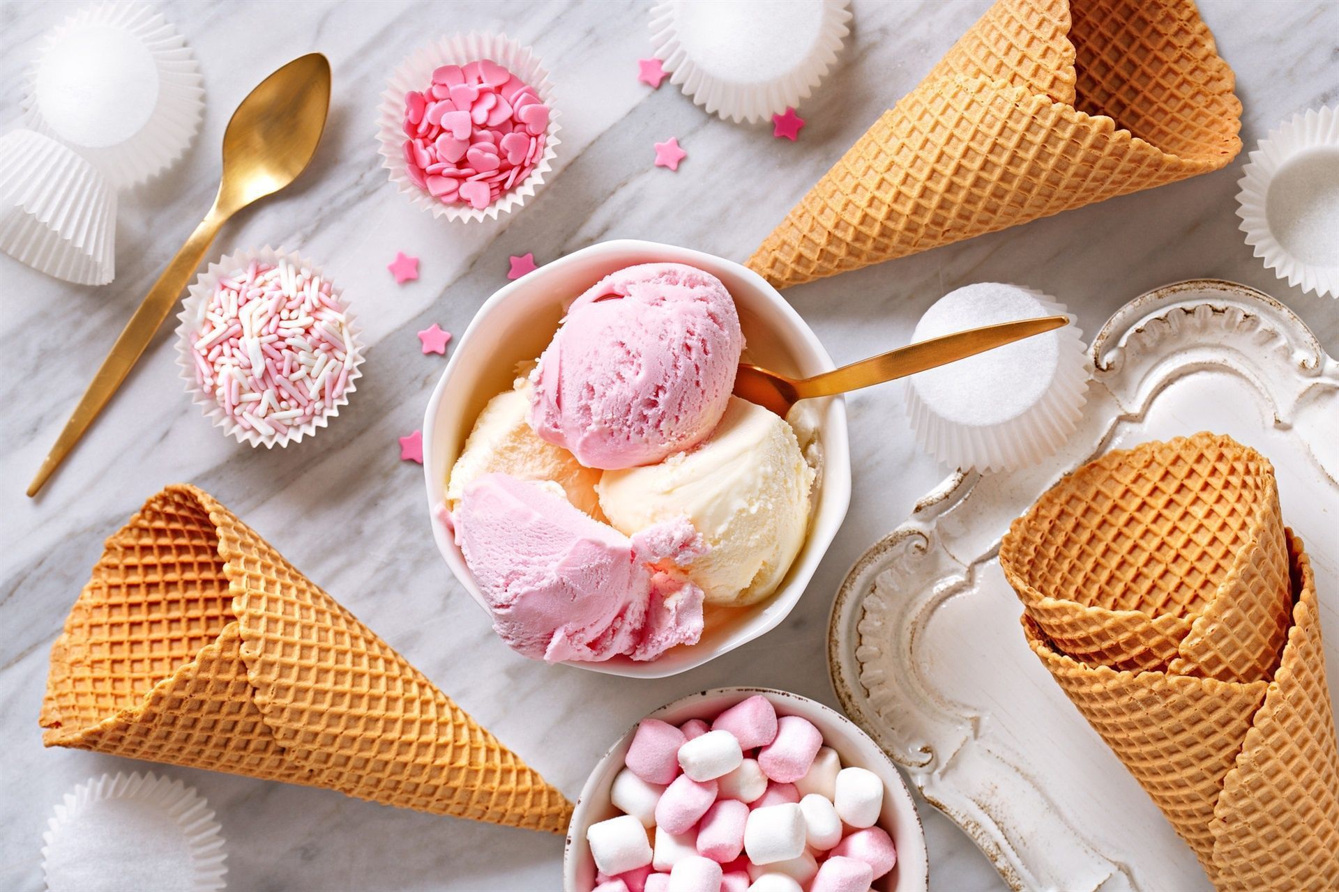 A table with ice cream cones and other treats - Ice cream