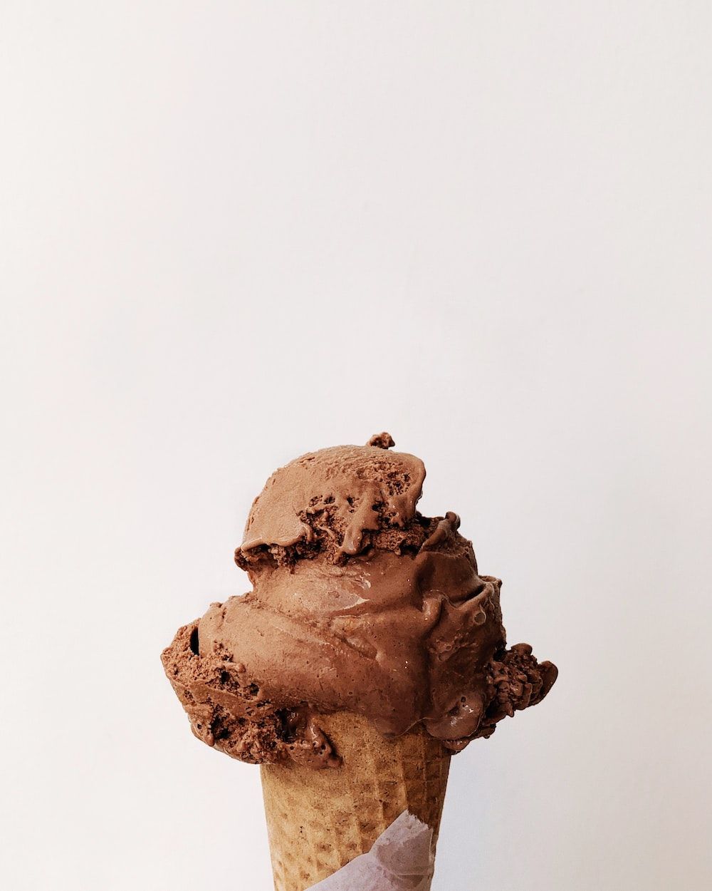 A person holding an ice cream cone - Ice cream