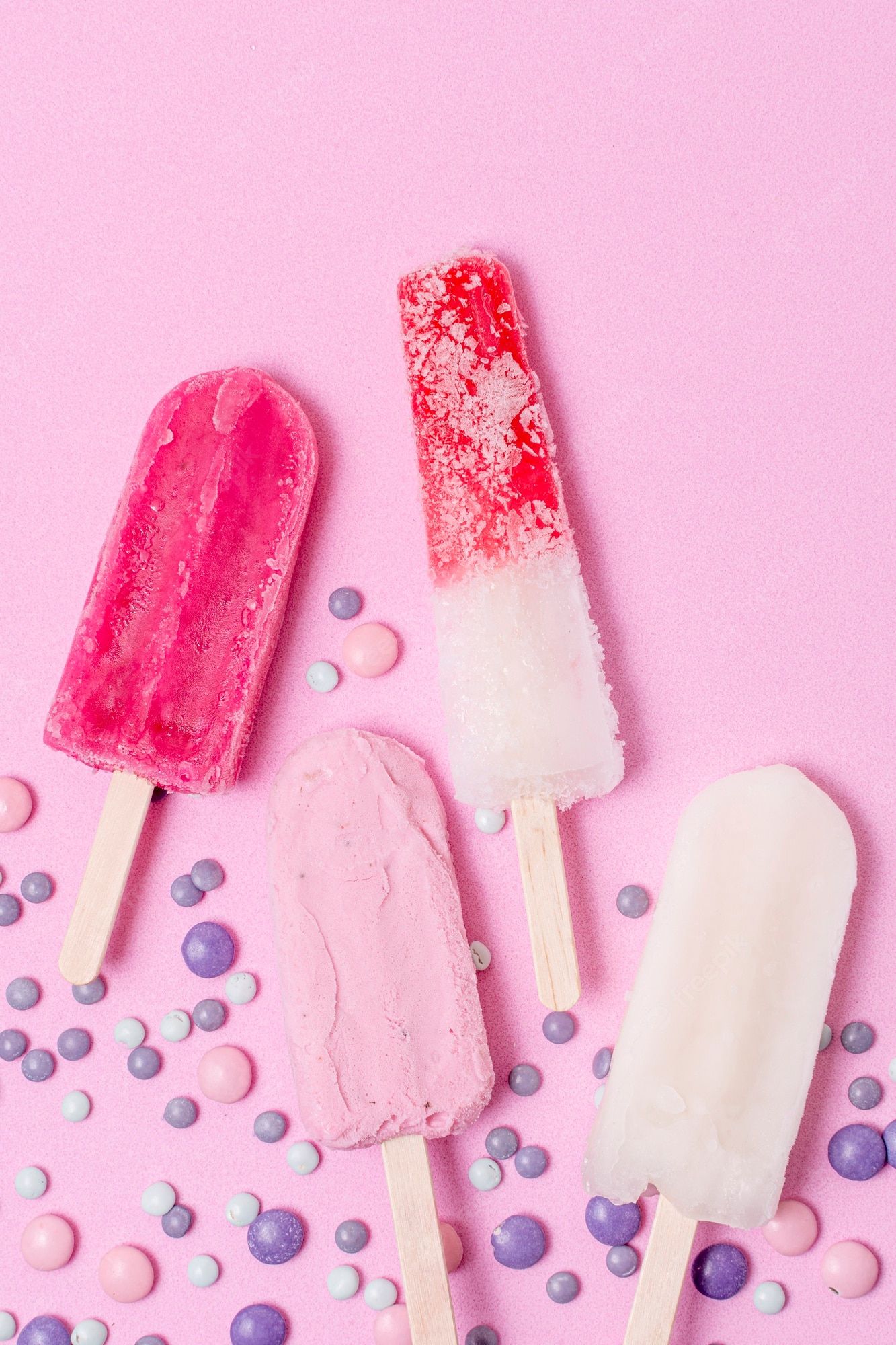 A group of popsicles on sticks with sprinkles - Ice cream