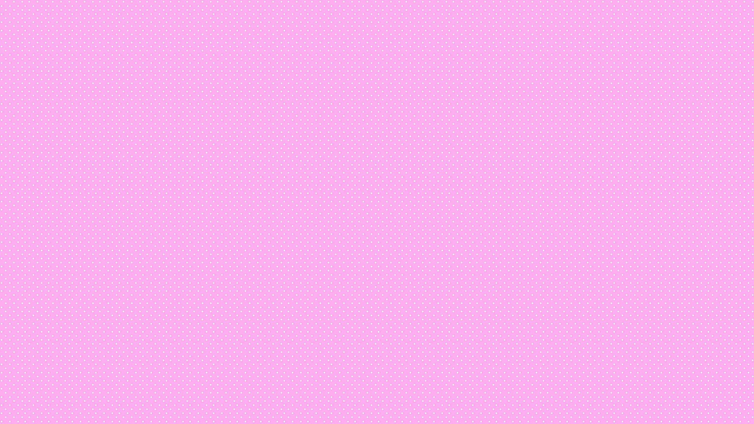 A pink background with a pattern of white dots - Hot pink
