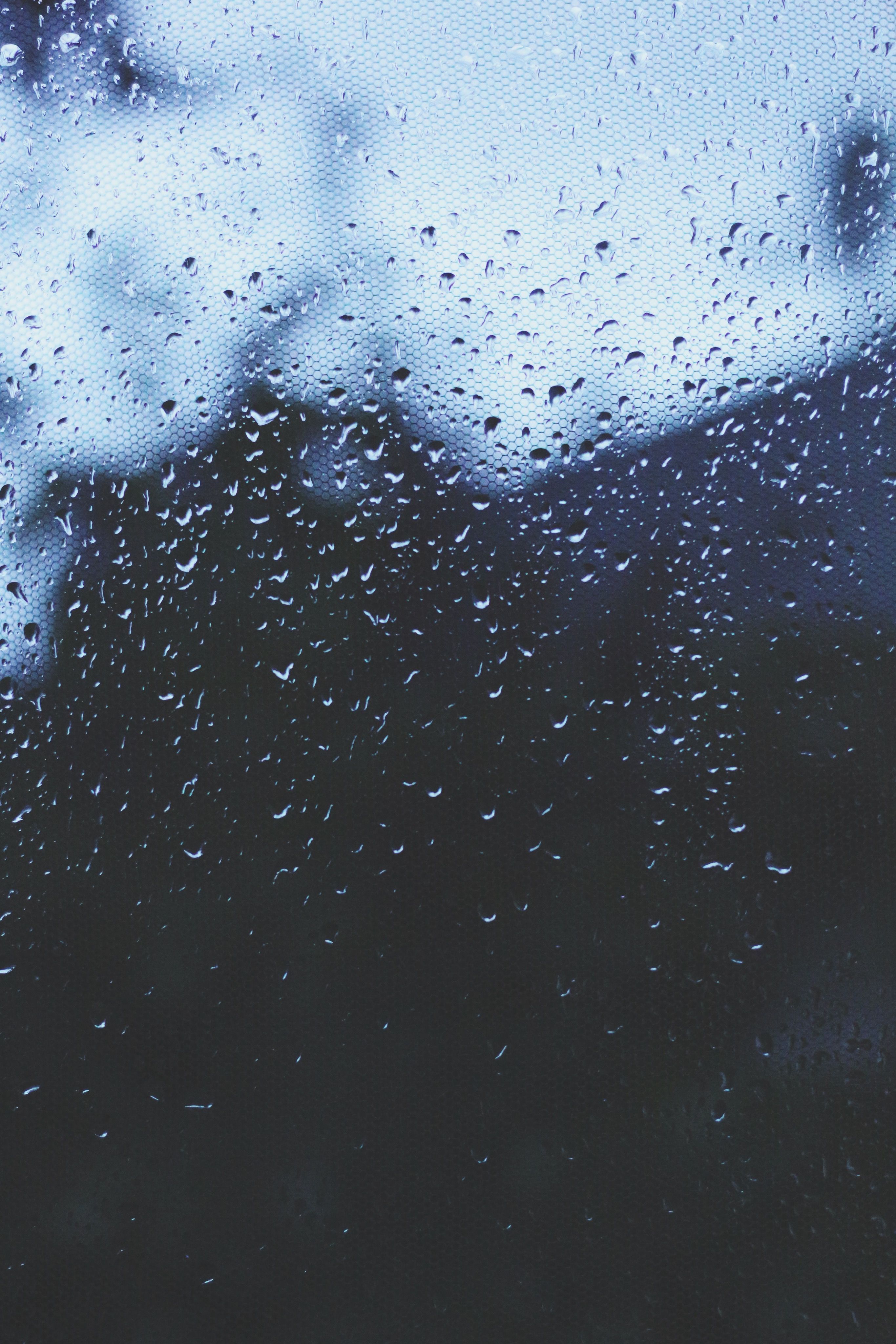 A rain droplet on the window of an office building - Rain