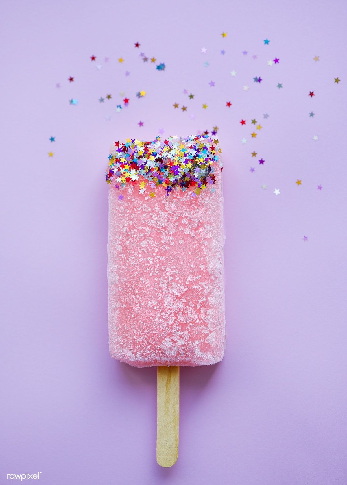 Pink popsicle with sprinkles on a purple background - Ice cream