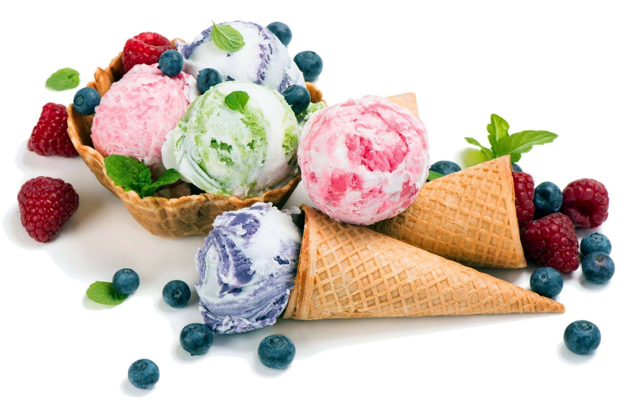 A bowl of ice cream with berries and cones - Ice cream