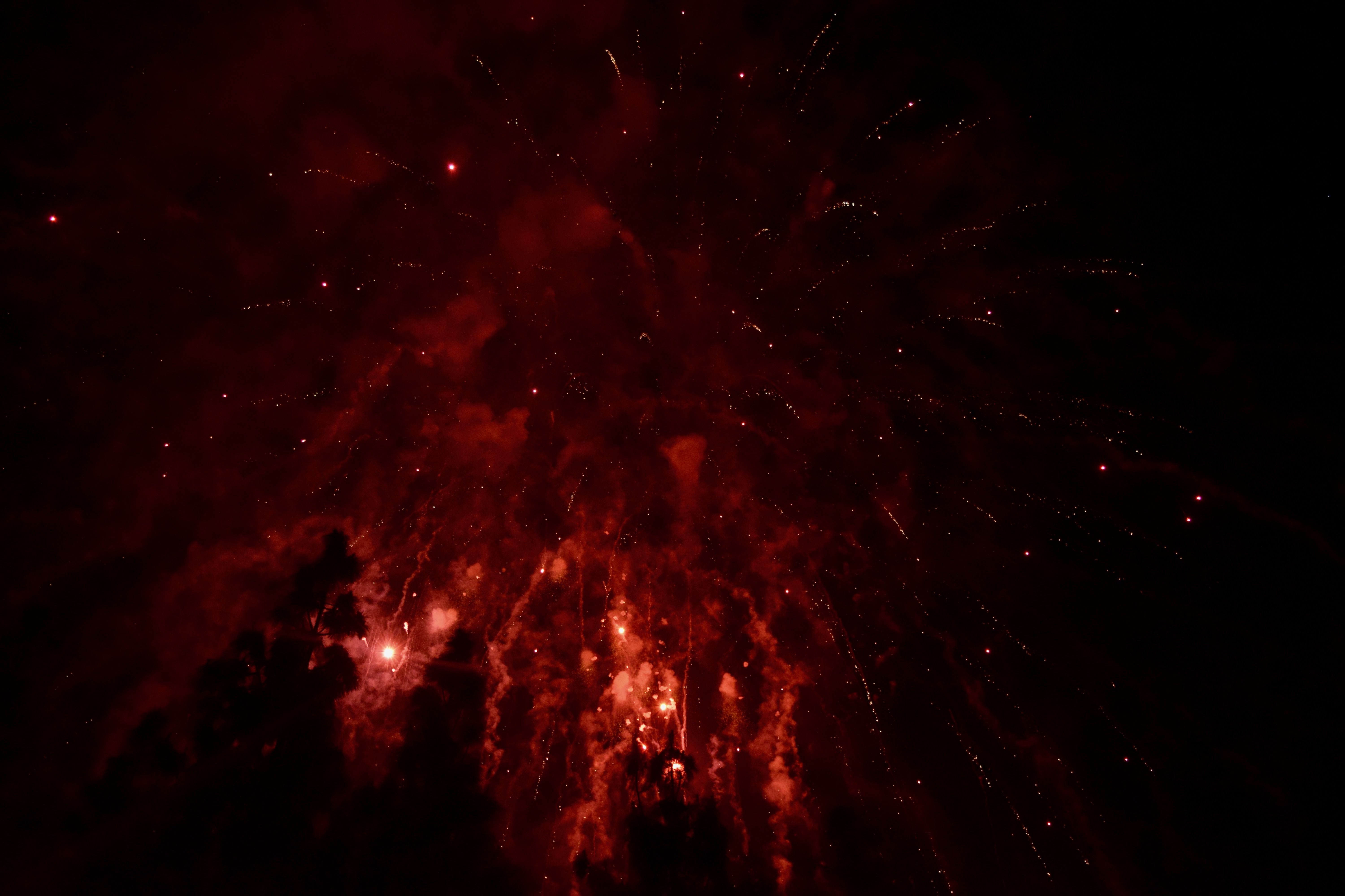 A fireworks show in the dark sky - Dark red