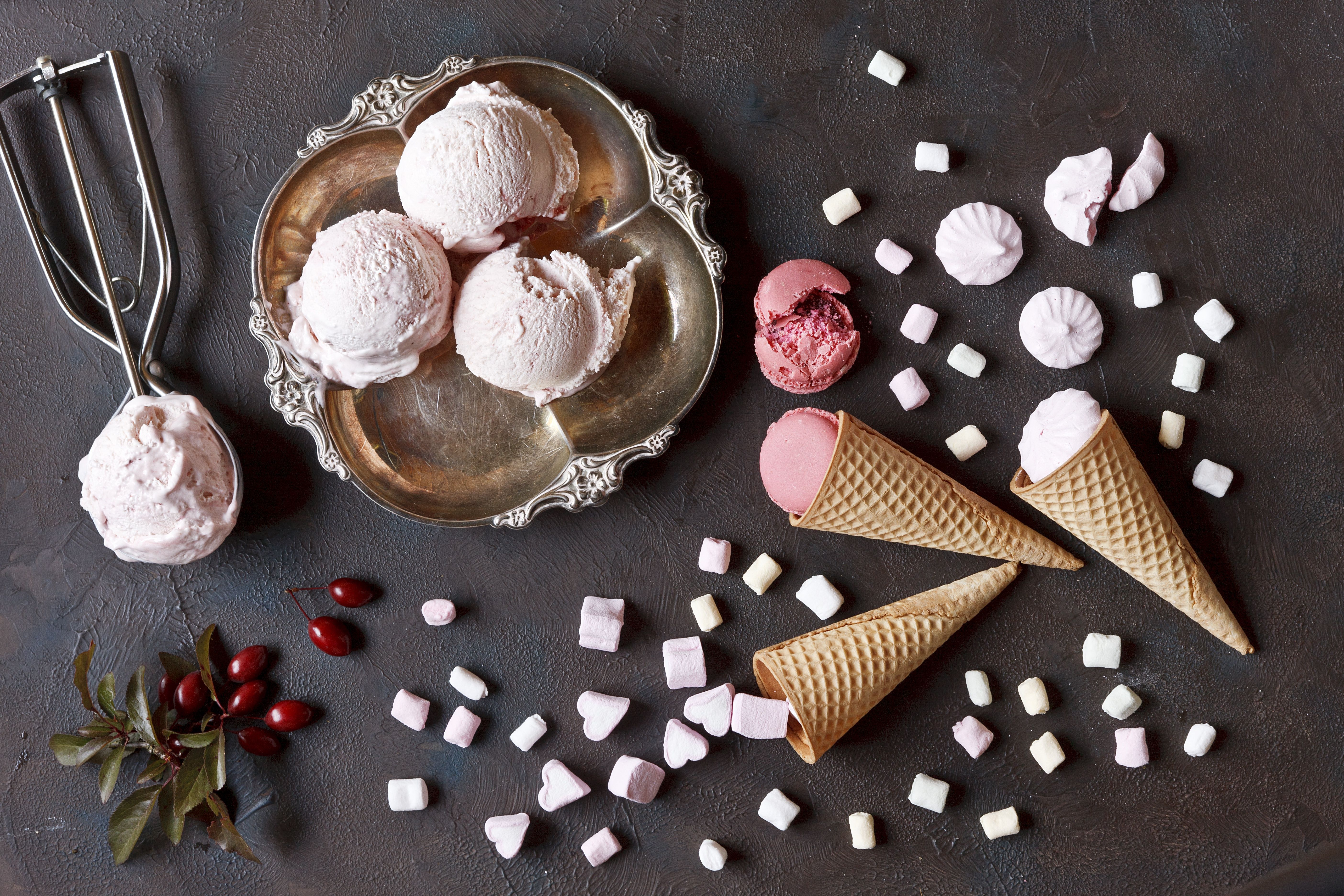 A group of ice cream cones with toppings - Ice cream