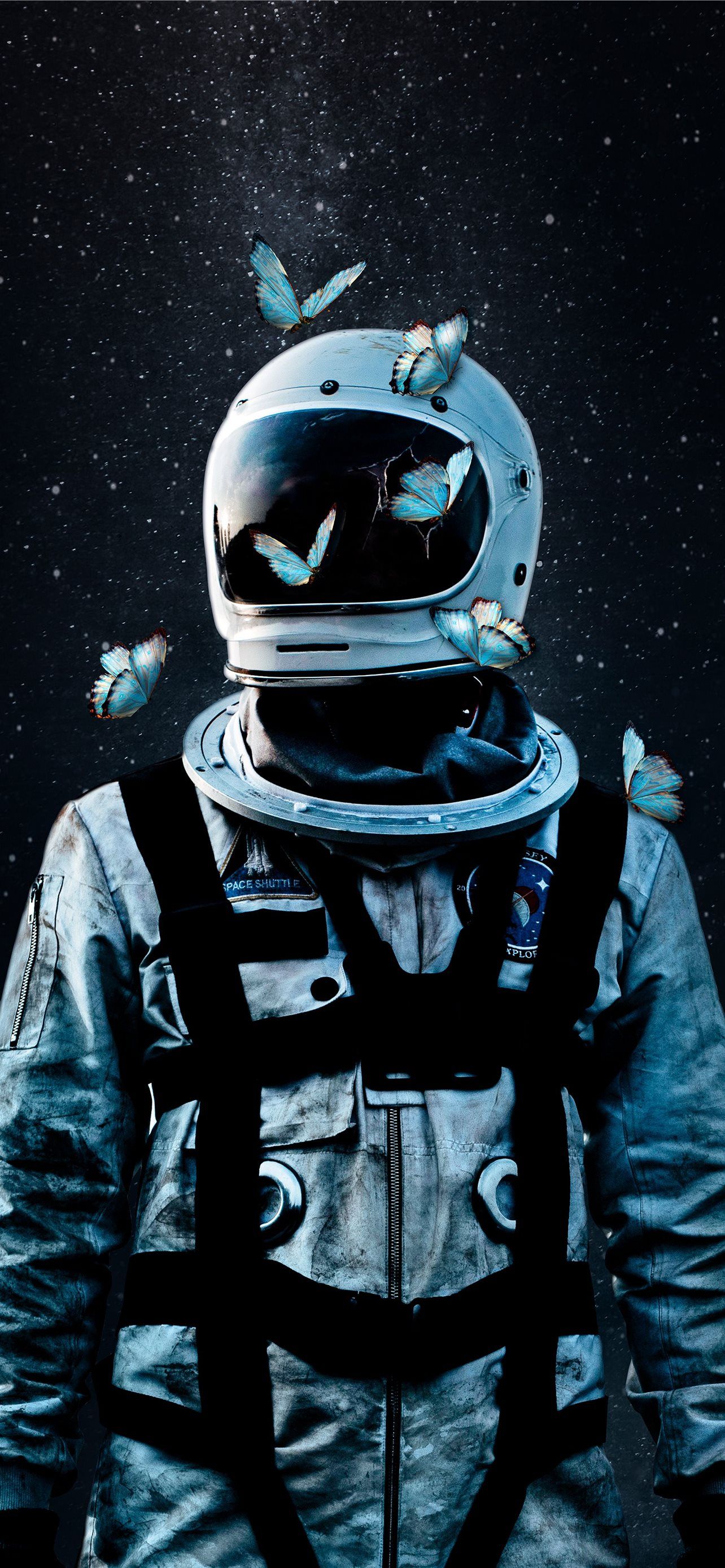 A man in an astronaut suit with butterflies on his head - Astronaut