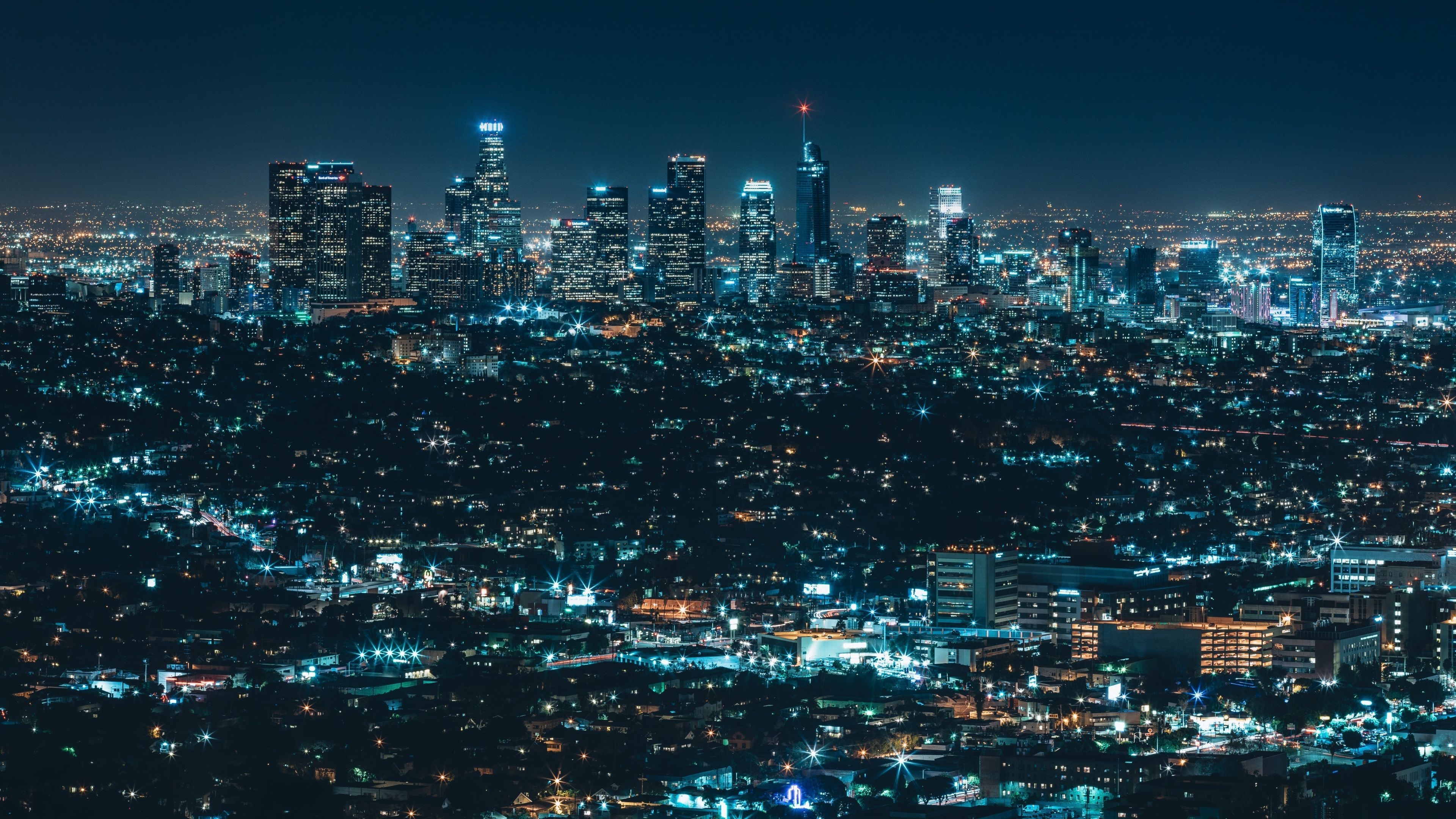 A city skyline at night with lights - Night