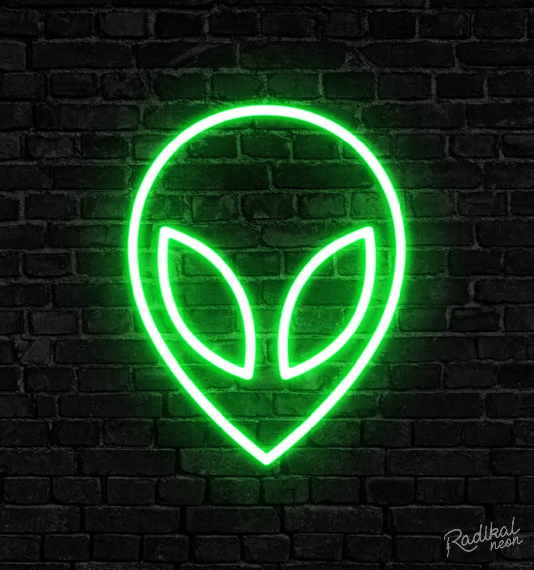 A neon sign of an alien's face on a brick wall - Neon green, alien