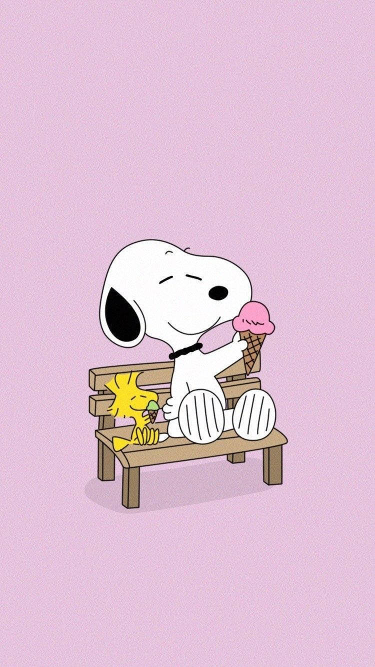 A cartoon character sits on the bench with an ice cream cone - Charlie Brown, Snoopy, ice cream
