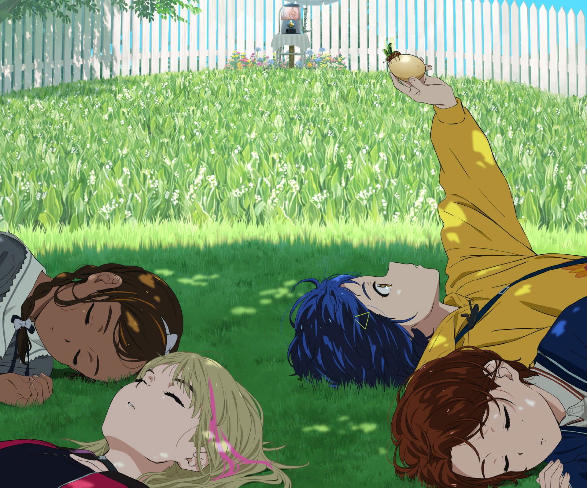 A group of people laying in the grass - Egg