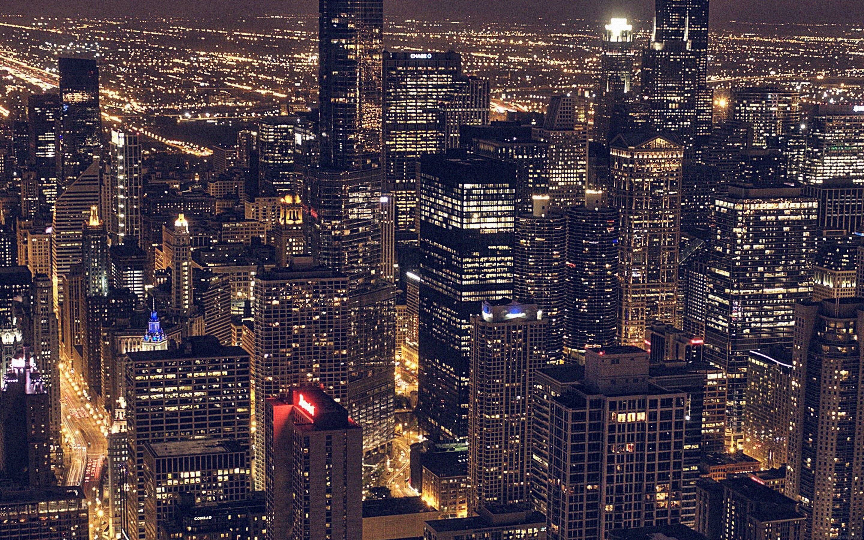 A nighttime cityscape of the Chicago Loop, with a sea of lights from the skyscrapers. - Chicago