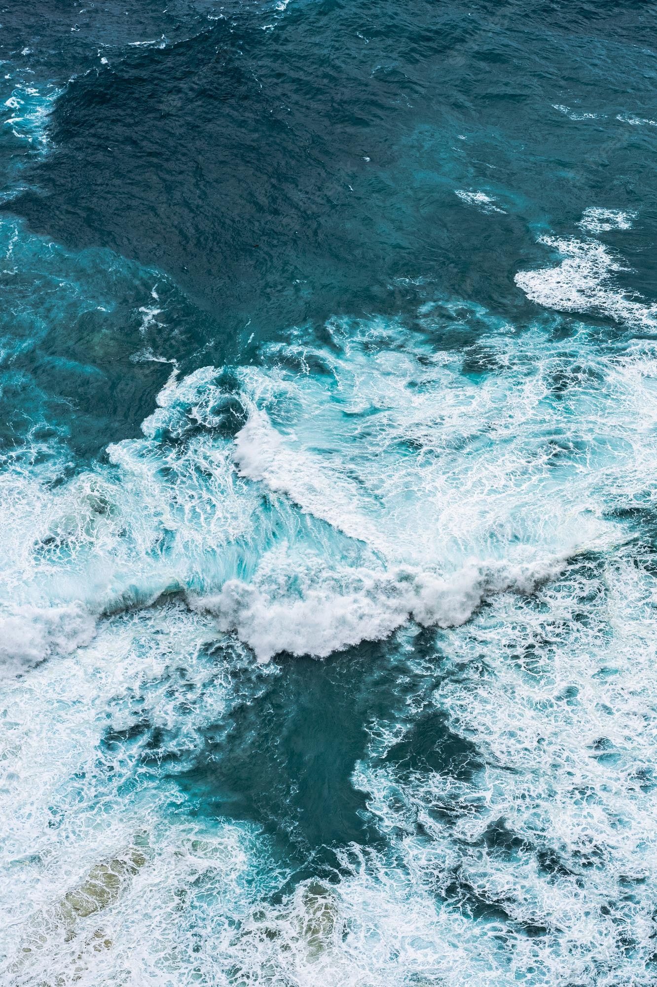 Aerial view of the waves in the ocean - Ocean