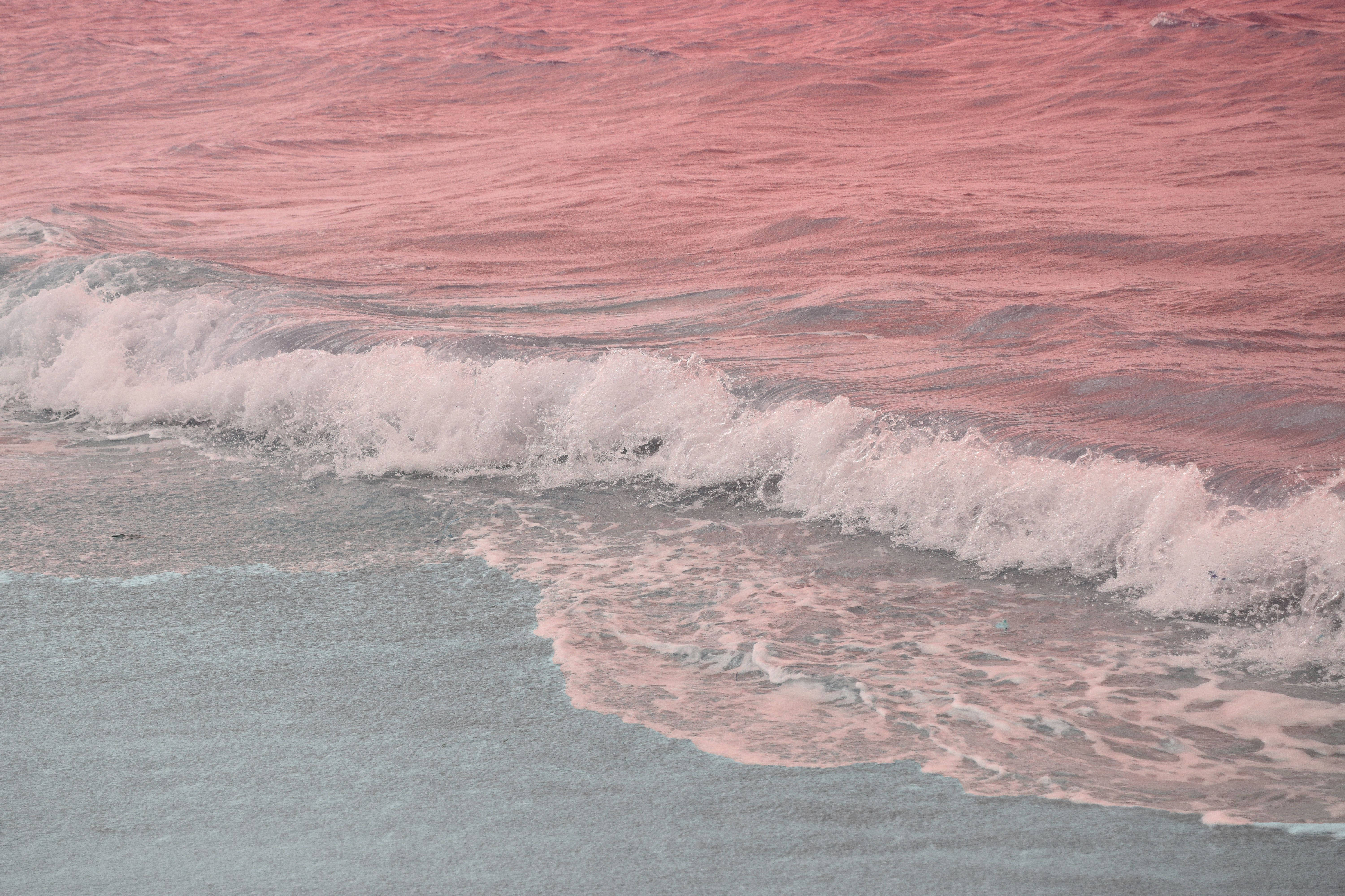 Download Aesthetic Ocean With Pink Water Wallpaper