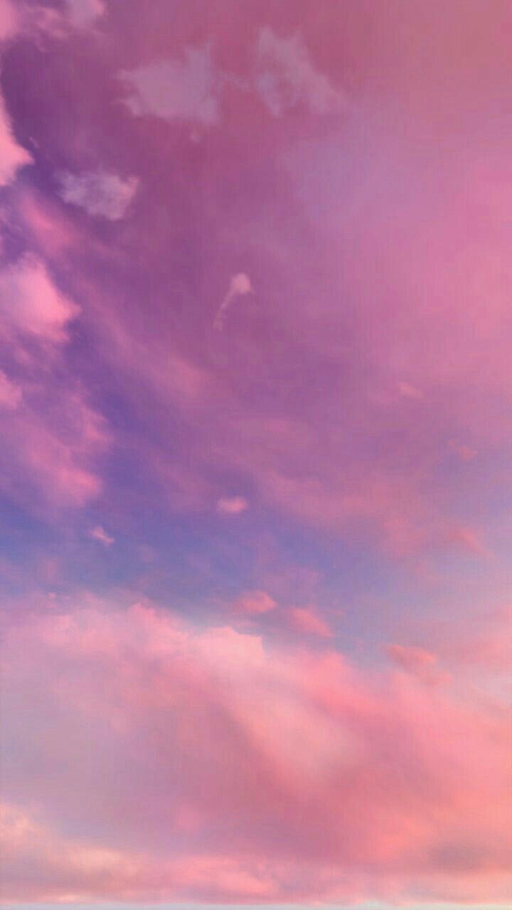A beautiful pink sky with a kite flying high in the clouds. Perfect for a pastel aesthetic wallpaper. - Sky