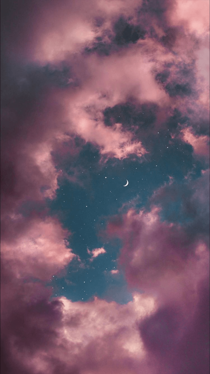 A crescent moon and stars in a cloudy sky. - Sky