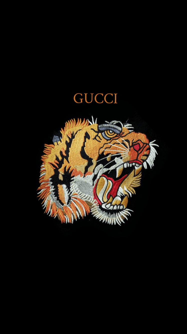 The gucci logo on a black background - Tiger