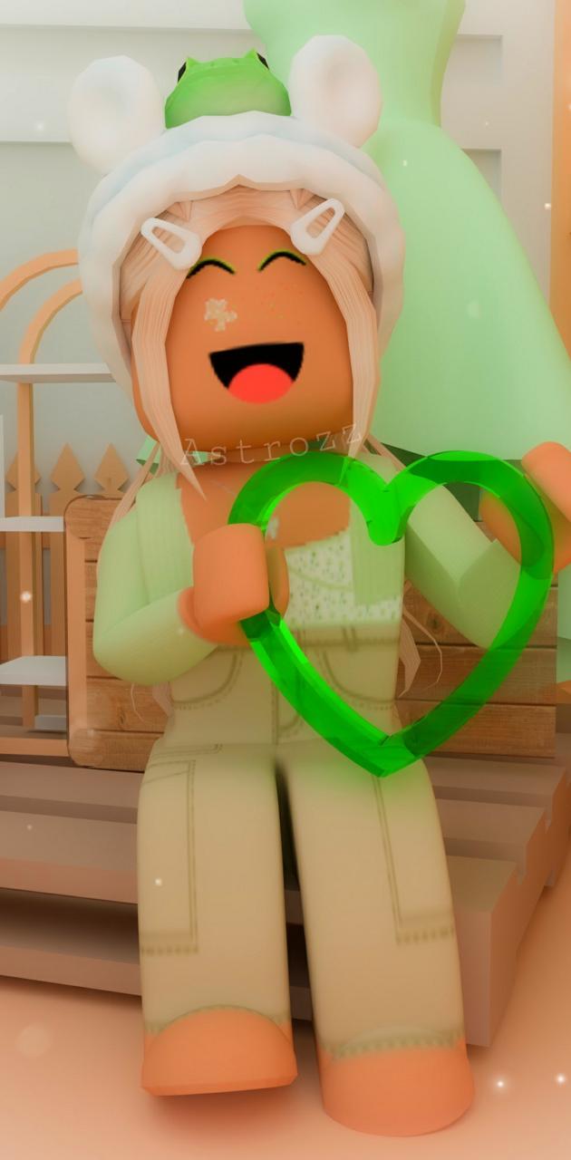 A Roblox character with blonde hair holding a green heart - Roblox