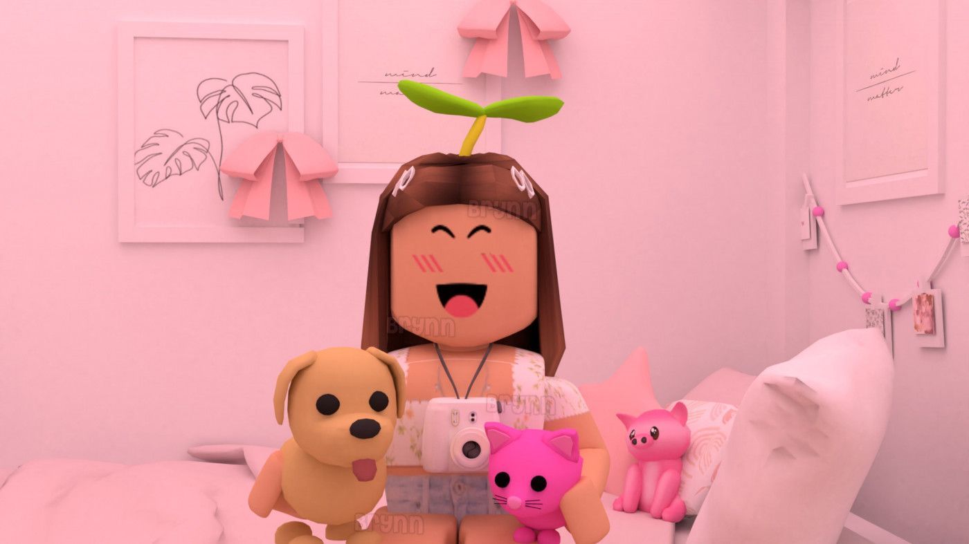 A Roblox character with brown hair and a green sprout on their head sits on a bed with a pink background. They are holding a camera and two stuffed animals, a dog and a cat. - Roblox