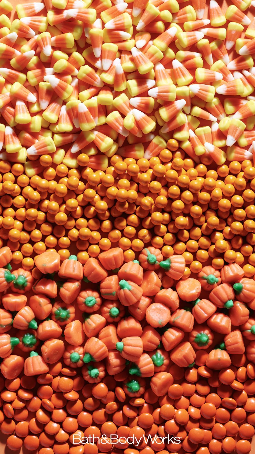 A close up of candy corn and other candies - Candy
