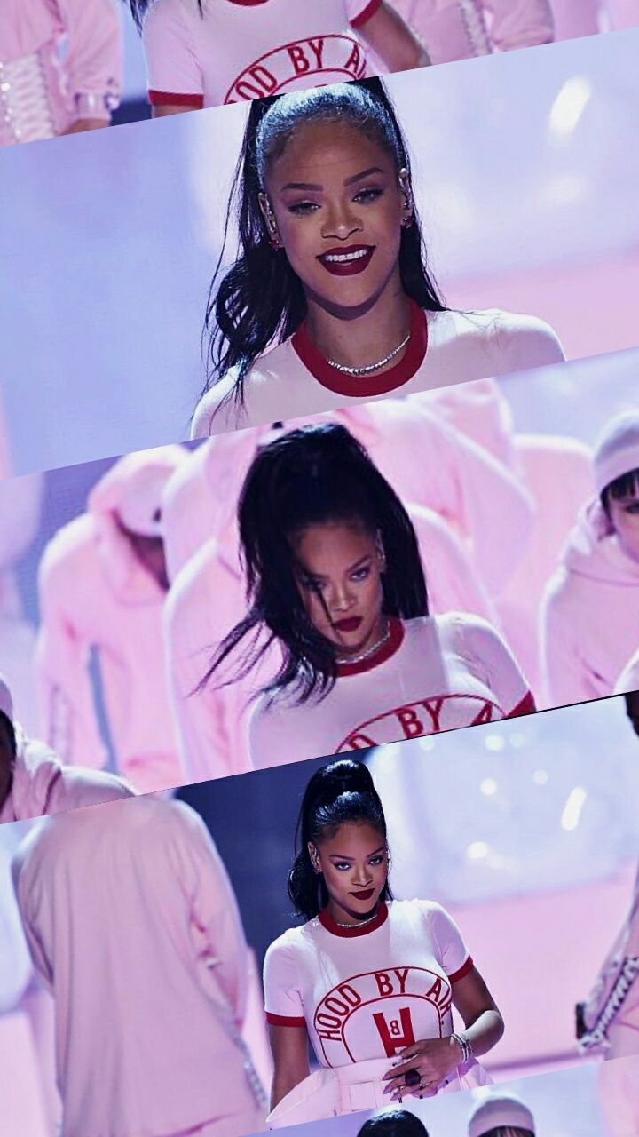 Rihanna performs on stage at the 2018 VMAs in a white t-shirt with the words 