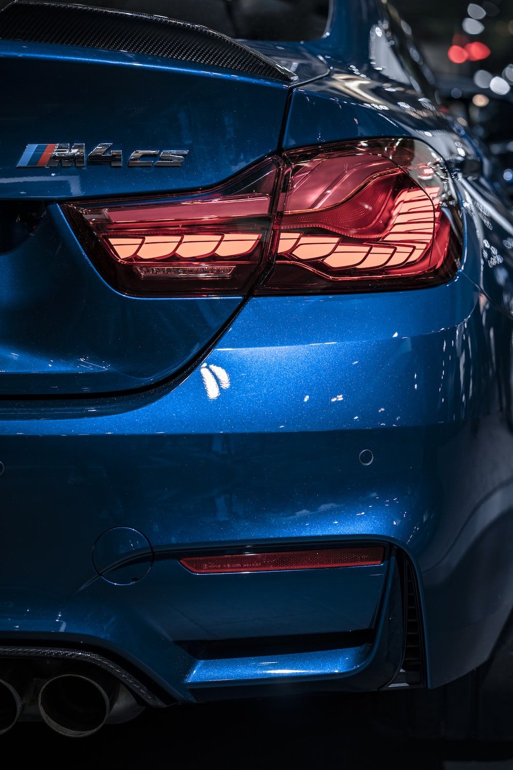 The rear lights of a blue car - BMW