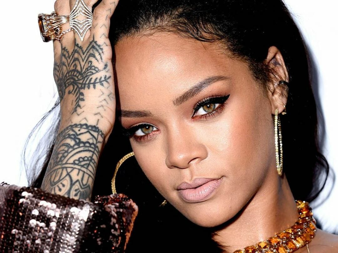 A woman with tattoos on her face - Rihanna