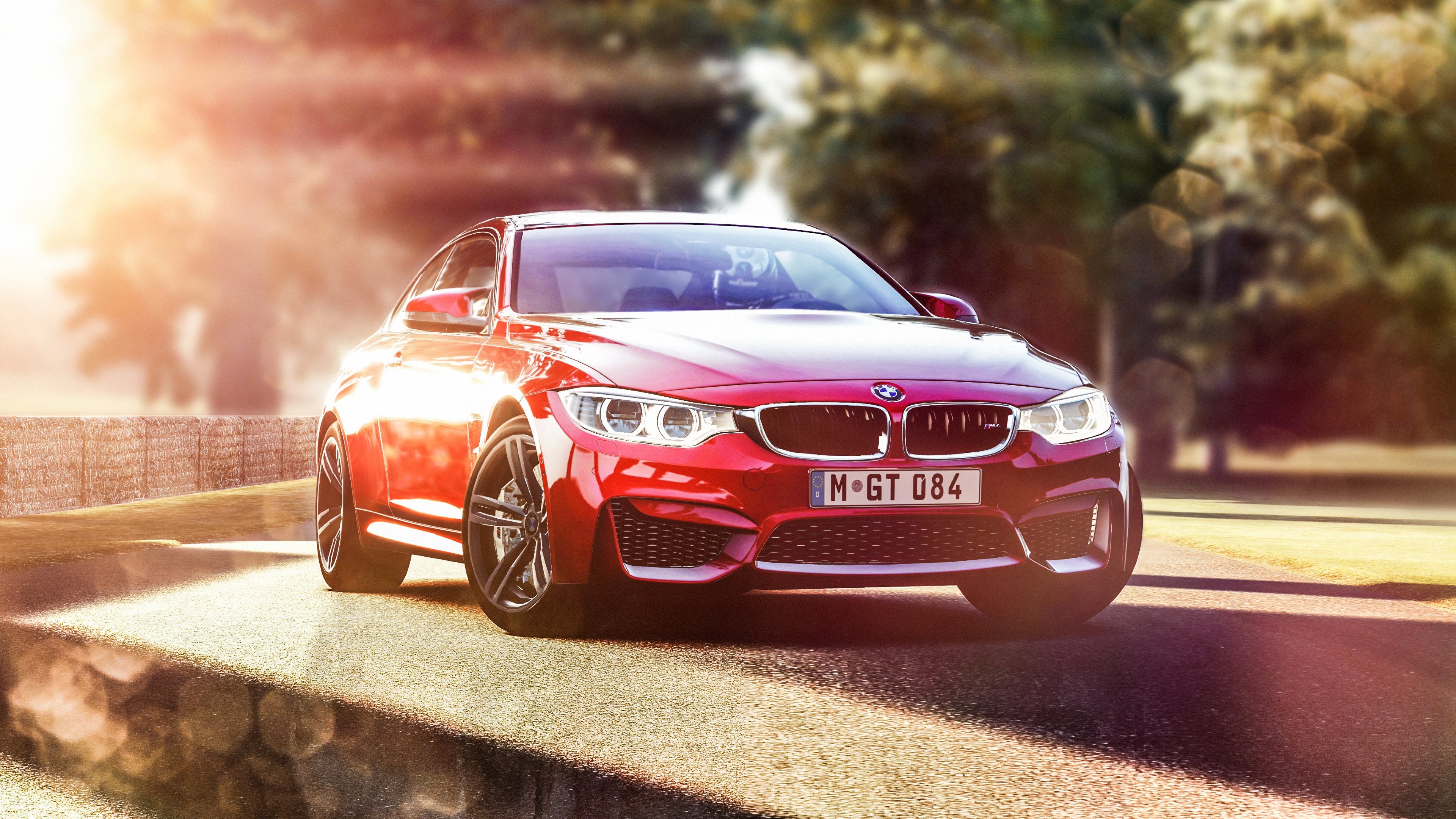 Red BMW M4 on the road - BMW
