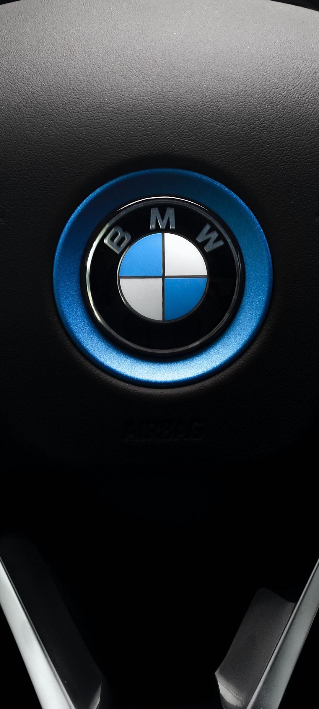 IPhone wallpaper of the BMW logo on the steering wheel - BMW