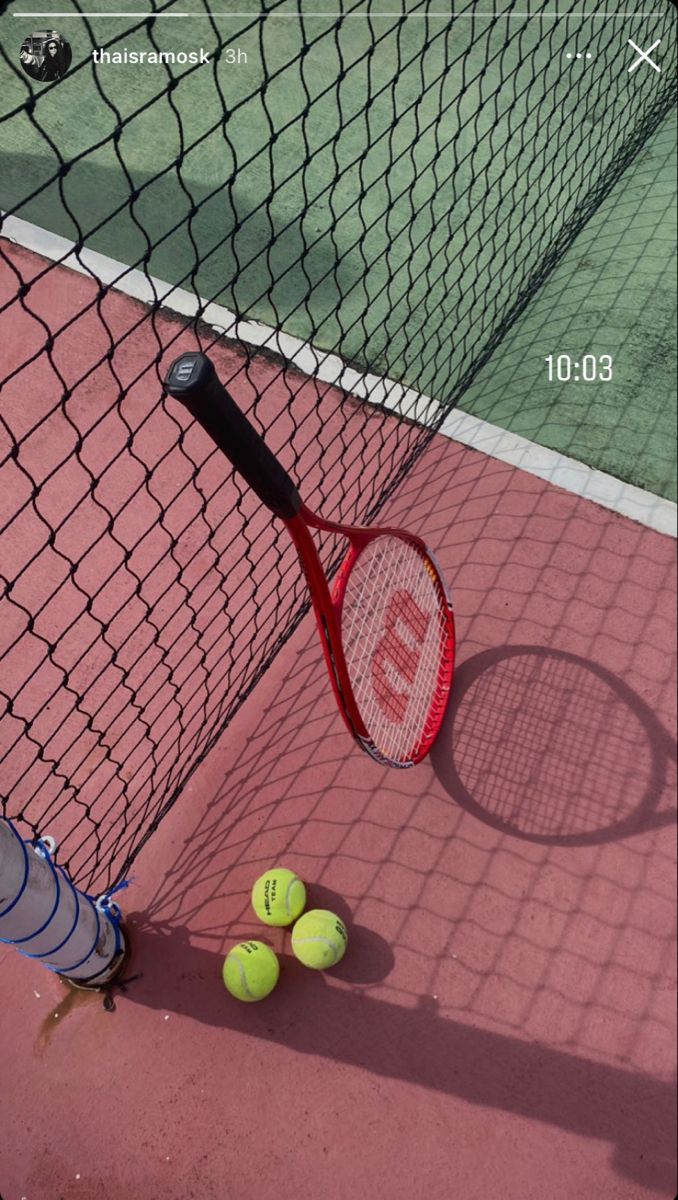 A tennis racket and balls on a tennis court - Tennis