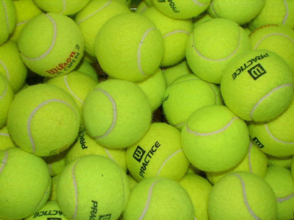 A pile of tennis balls that are yellow - Tennis