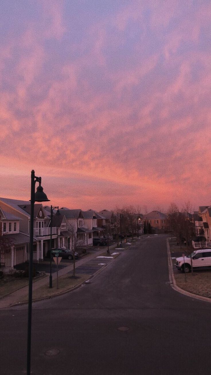 Pink sky over a quiet street in a neighborhood - Sunset