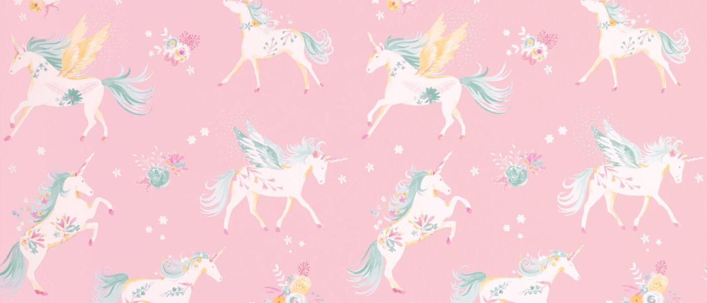 A pink background with illustrations of unicorns, some with wings, some with flowers on their horns, and some with flowers in their manes. - Unicorn