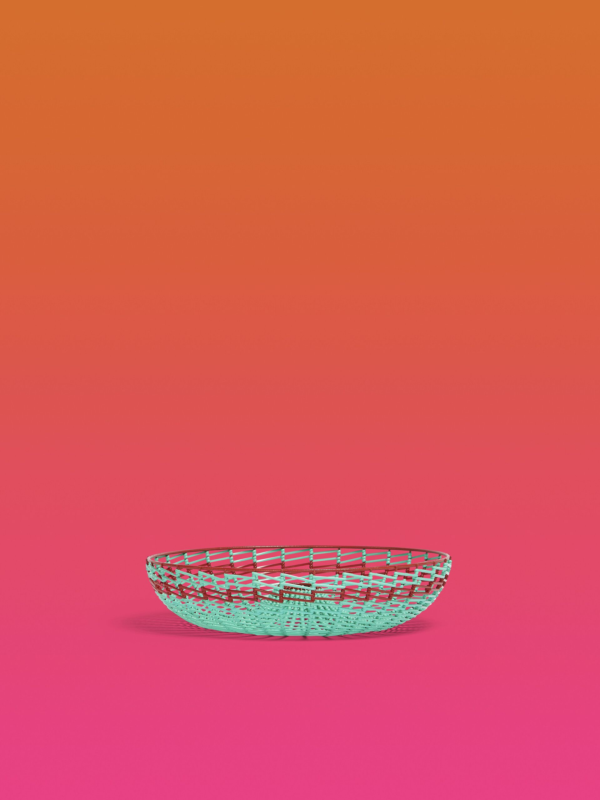 A bowl sitting on top of an orange surface - Turquoise